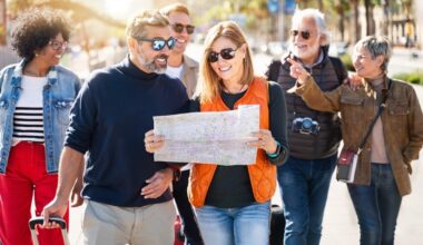 group of middle aged friends looking at a map while on a vacation together