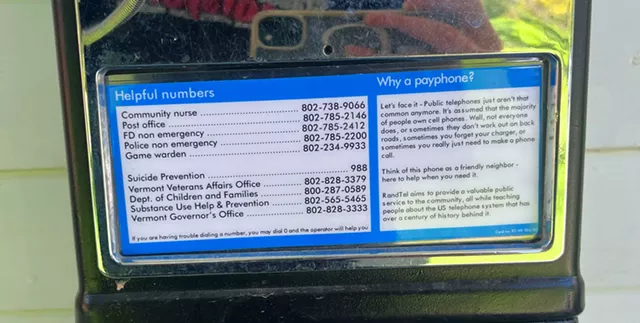 A list of helpful numbers on a RandTel phone - SAM HARTNETT ©️ SEVEN DAYS