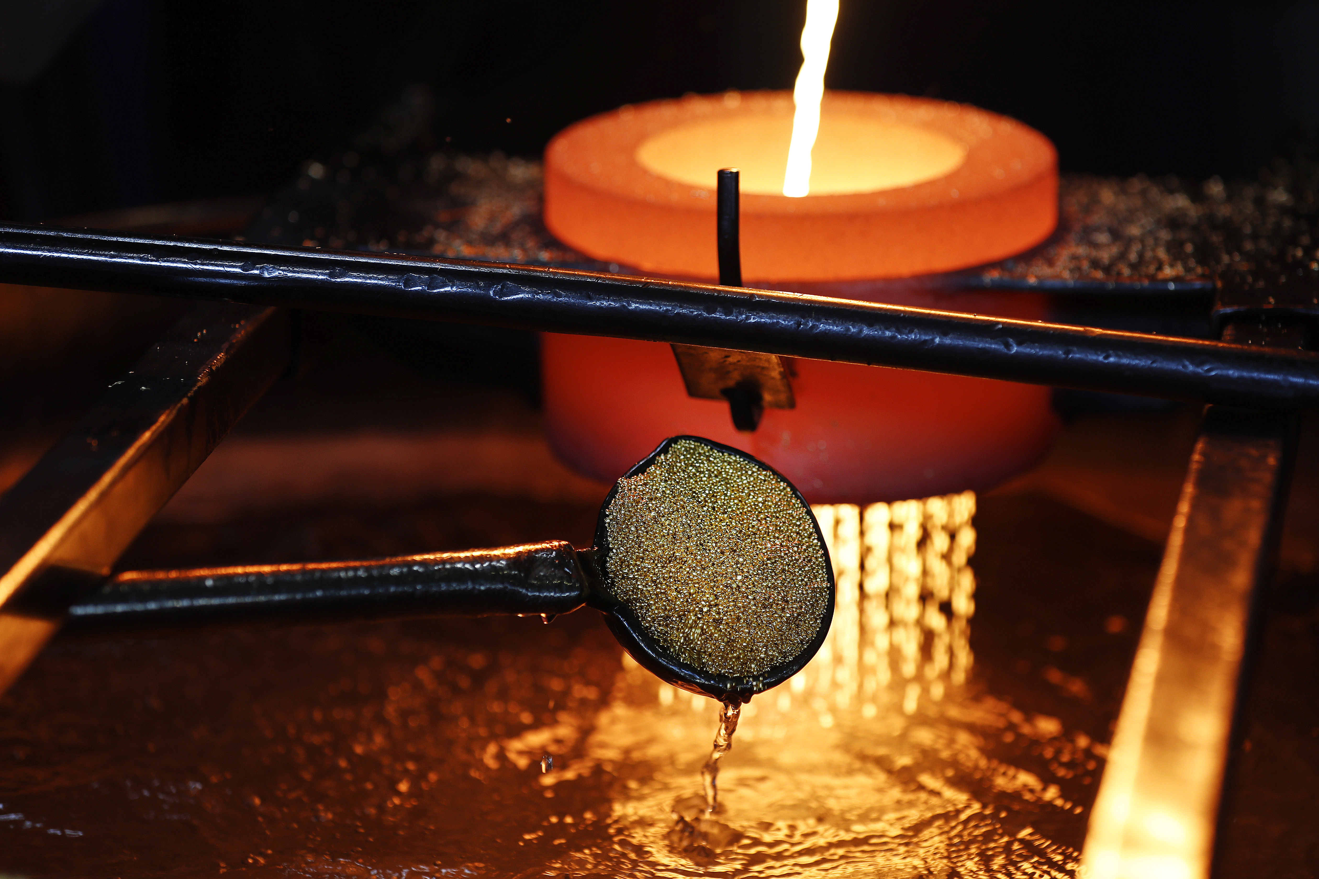 Molten gold being cooled in water at a refinery.