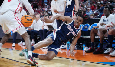 Mar 22, 2025; Wichita, KS, USA; Gonzaga Bulldogs guard Michael Ajayi (1) dives to keep the ball in play against Houston Cougars guard Mylik Wilson (8) during the first half at Intrust Bank Arena. Mandatory Credit: Kirby Lee-Imagn Images