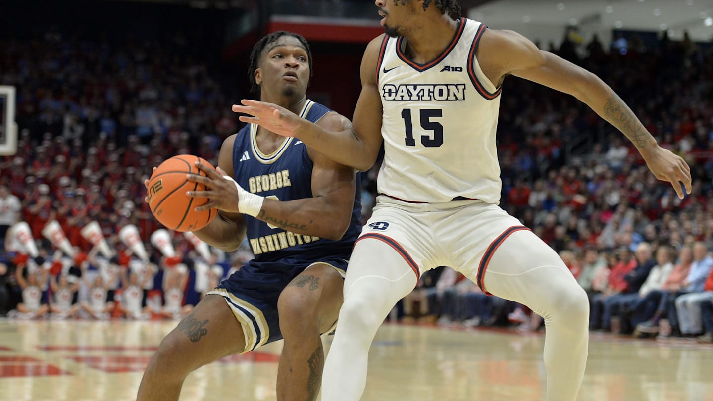 Jan 30, 2024; Dayton, Ohio, USA;  George Washington forward Darren Buchanan Jr. (3) drives against Dayton Flyers forward DaRon Holmes II (15) at University of Dayton Arena. Mandatory Credit: Matt Lunsford-Imagn Images