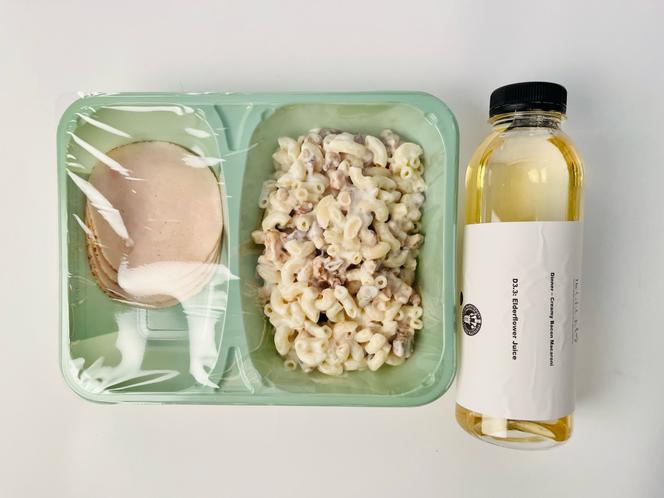 A dinner made from ultra-processed foods served to study participants: creamy pasta with bacon pieces, chicken slices, and an elderflower drink, March 3, 2022, at the medical faculty in Copenhagen.