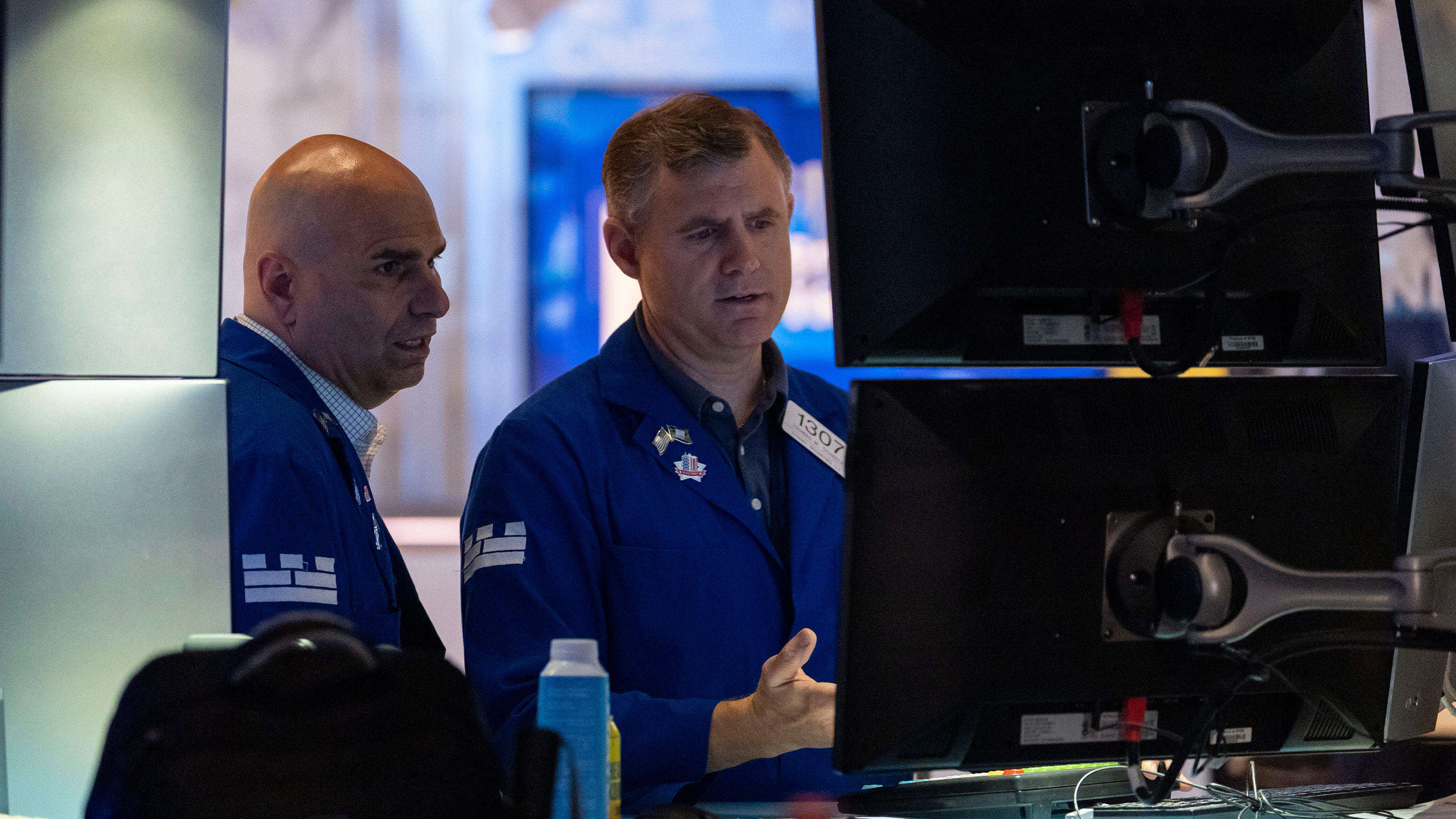 Traders work on the floor of the New York Stock Exchange, Friday, Aug. 1, 2025, in New York.