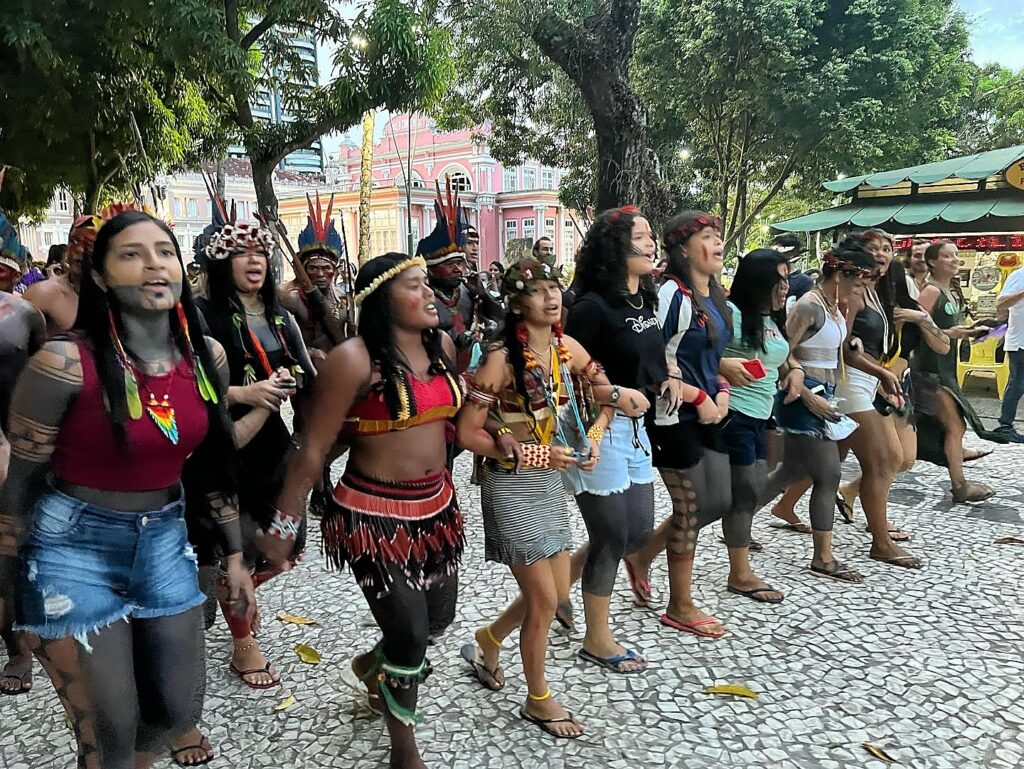 A group of Indigenous women marches through the streets of Belém, Brazil, during the Pan-Amazon conference known as FOSPA in 2022. Credit: Katie Surma/Inside Climate News