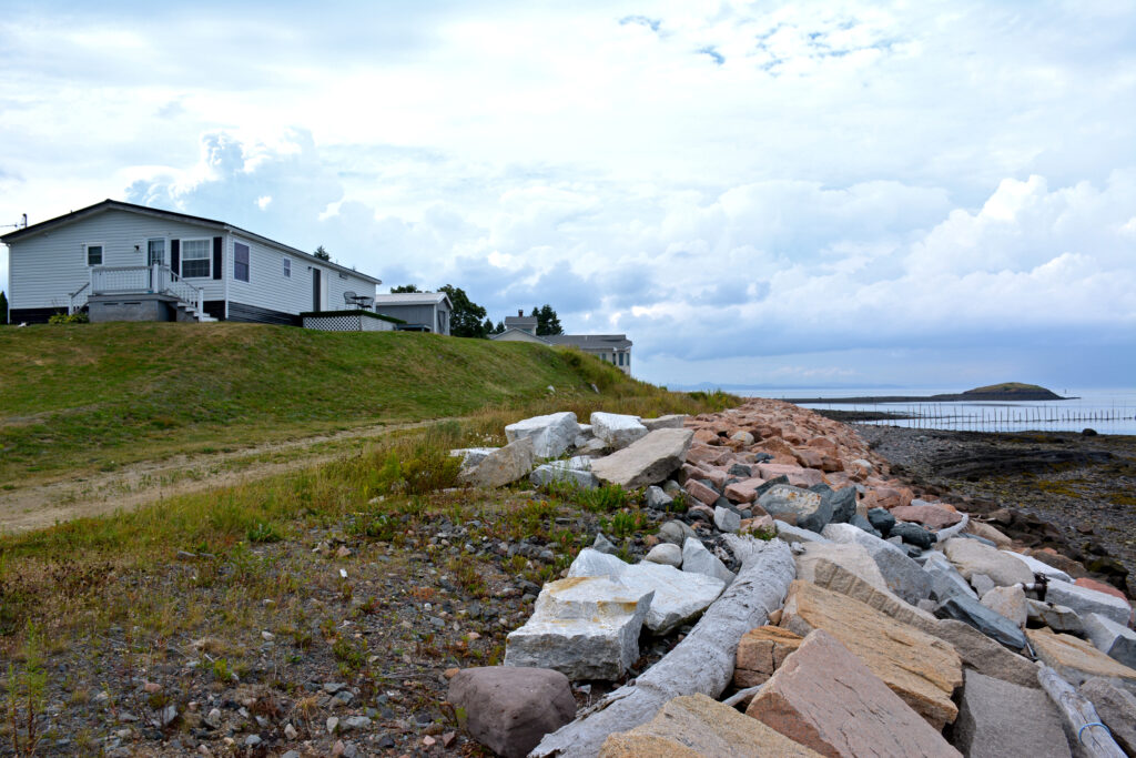 Homes on the eastern side of the Sipayik peninsula are facing erosion of the coastal bluffs beneath them and risk of flooding from encroaching tides. Credit: Sydney Cromwell/Inside Climate News