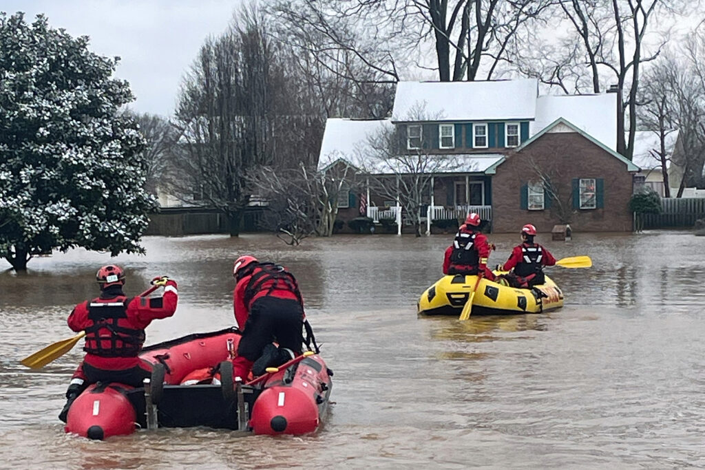 Clarksville Fire Rescue members perform water rescues to evacuate people trapped during intense flooding after heavy rains on Feb. 16 in Clarksville, Tenn. Credit: Clarksville Fire Rescue via Getty Images