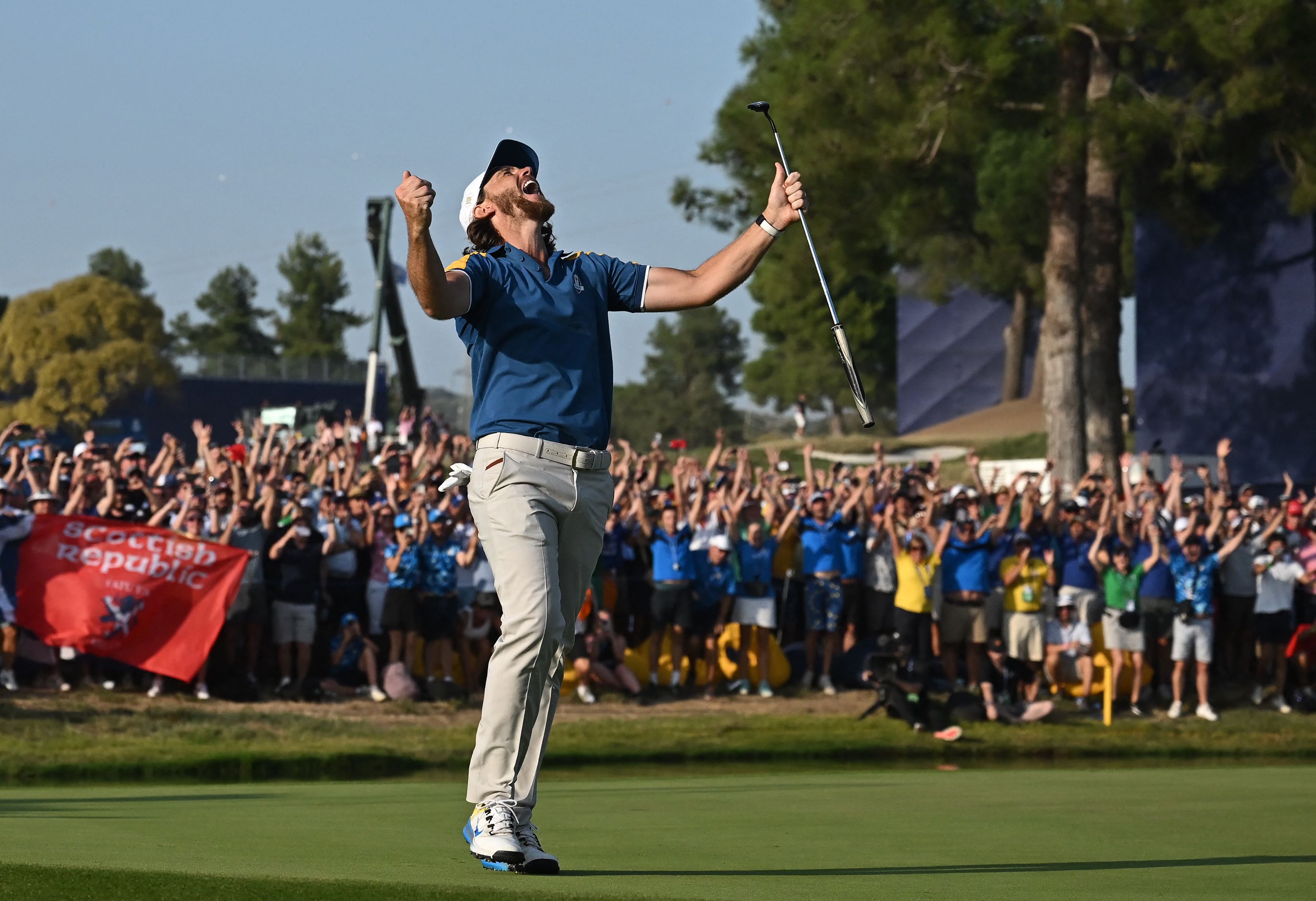 Tommy Fleetwood celebrates a winning putt at the Ryder Cup.