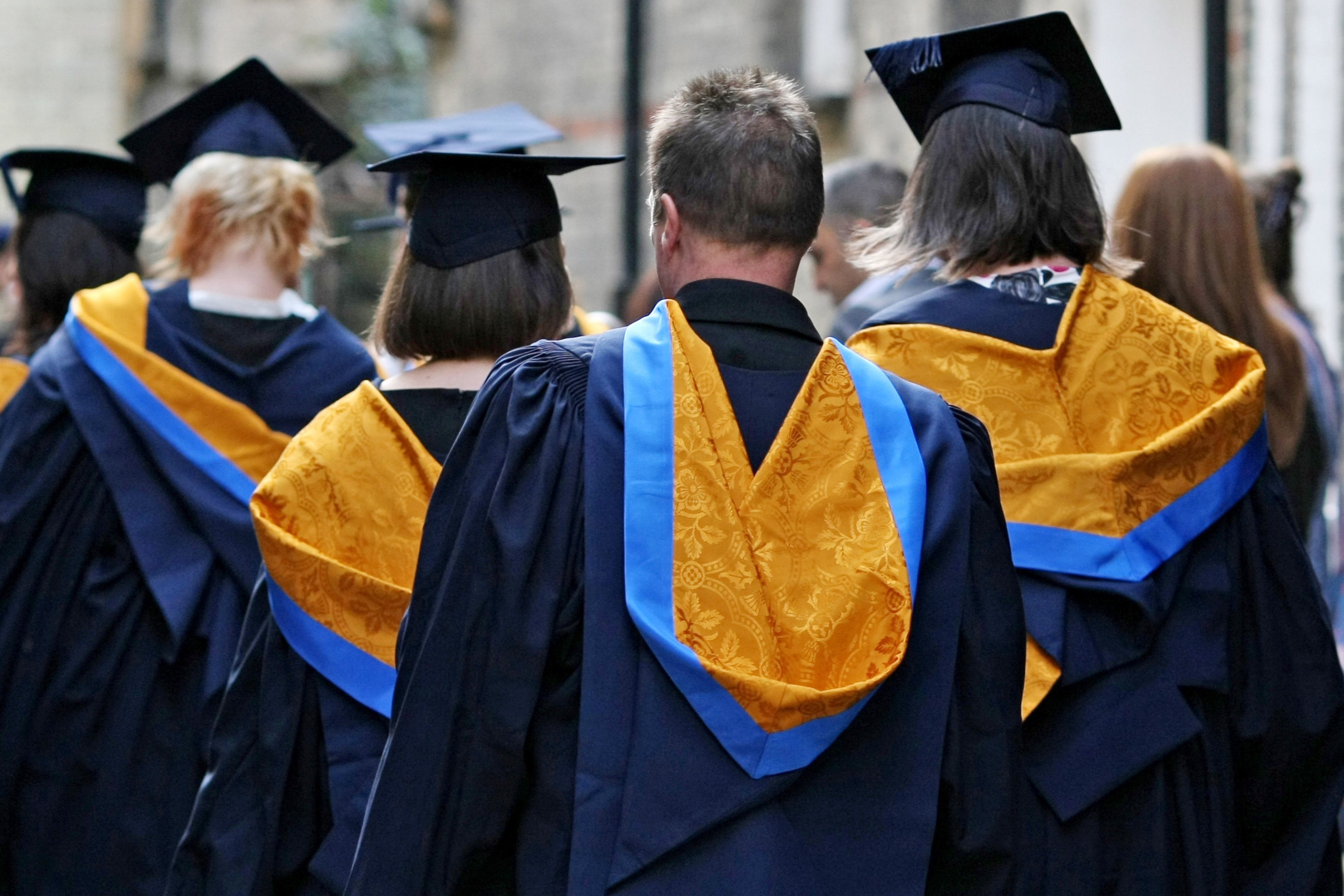 University graduates in caps and gowns.