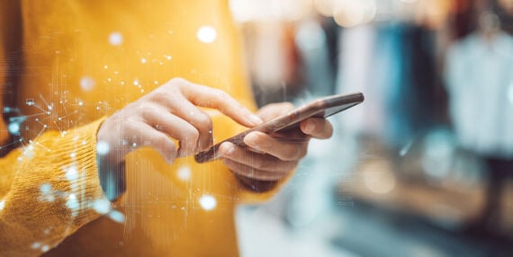 Image showing human hands holding a smartphone.