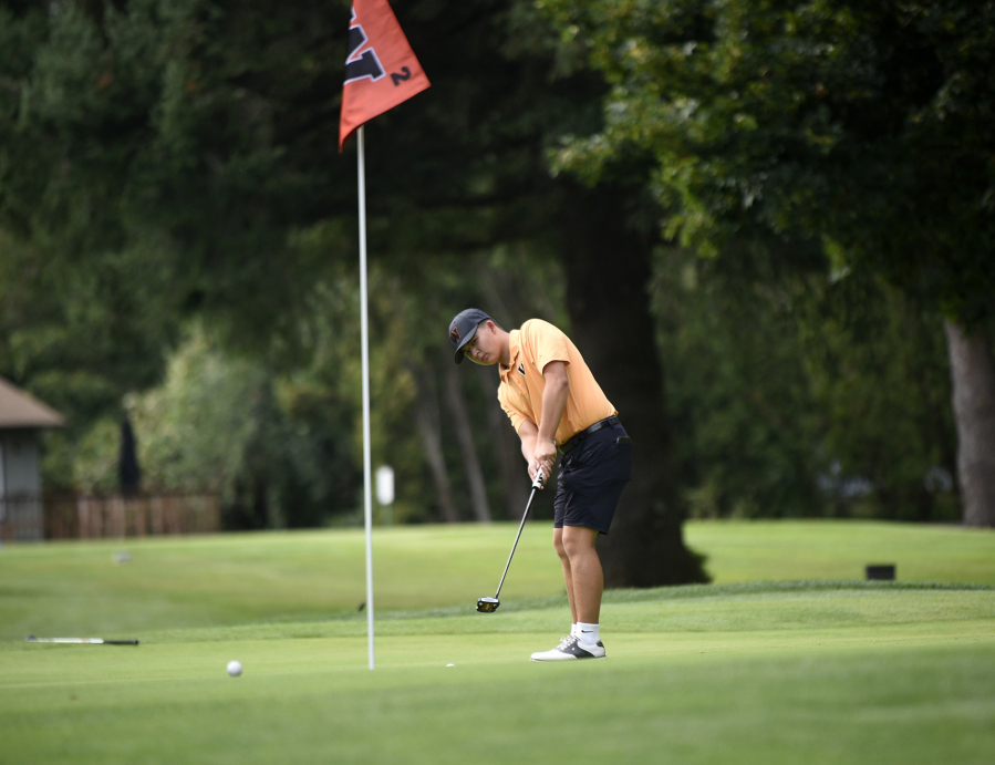 Washougal golfer Noah Migaki putts on the No. 2 green at Orchard Hills Golf and Country Club in Washougal during a high school match on Monday, Sept. 8, 2025.