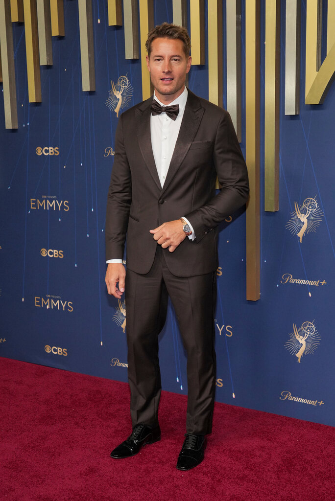 A man wears a brown suit.