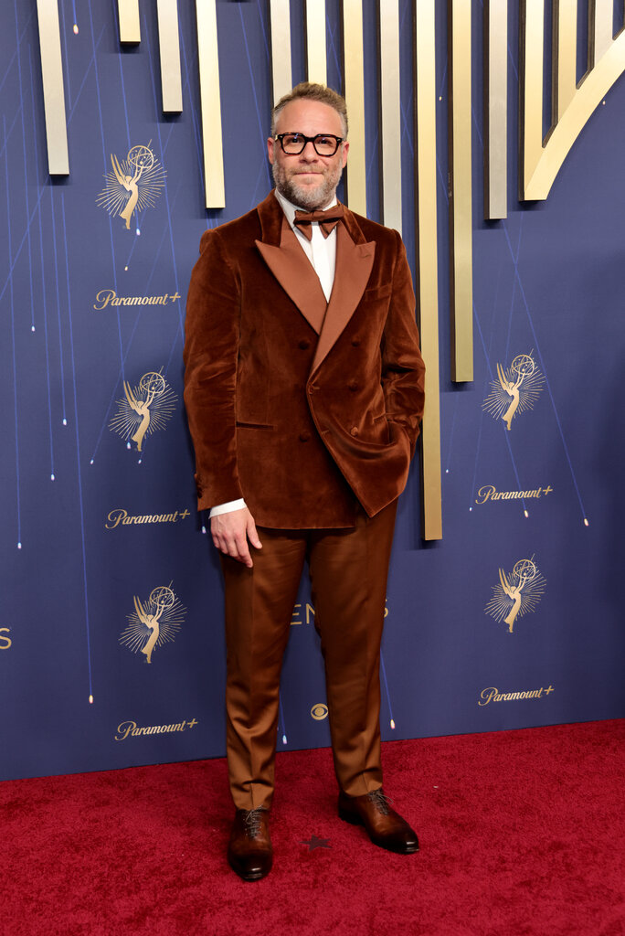 A man wears a copper-colored suit.