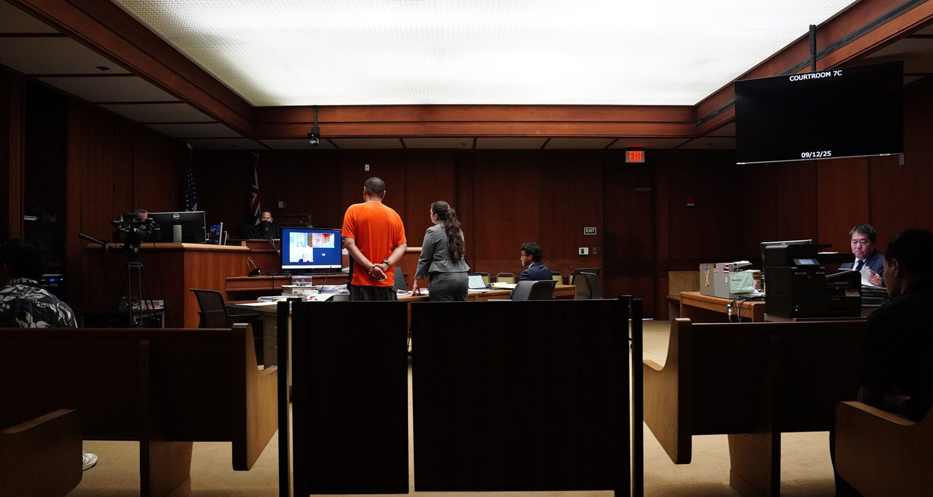 Jonathan Desoto, wearing orange, appears in court for his case Friday, Sept. 12, 2025, in Honolulu. (Kevin Fujii/Civil Beat/2025)