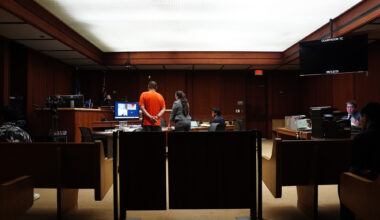 Jonathan Desoto, wearing orange, appears in court for his case Friday, Sept. 12, 2025, in Honolulu. (Kevin Fujii/Civil Beat/2025)