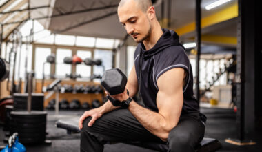 A man performing a concentration bicep curl