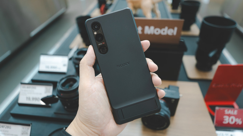 Hand holding Sony Xperia 1V with Style Cover Case
