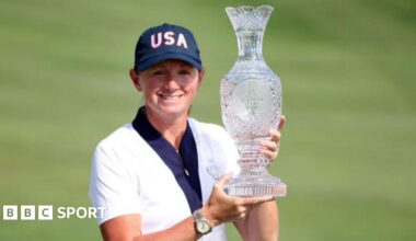 Stacy Lewis holding the Solheim Cup