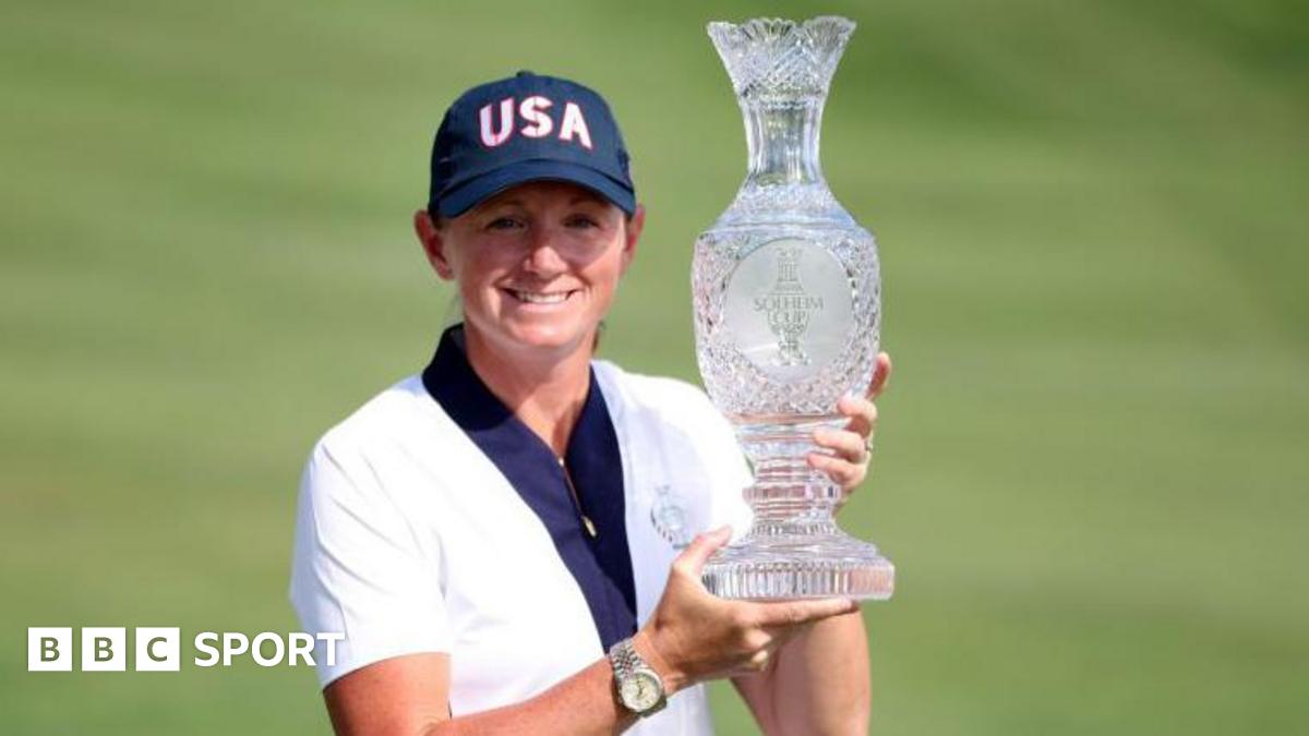 Stacy Lewis holding the Solheim Cup