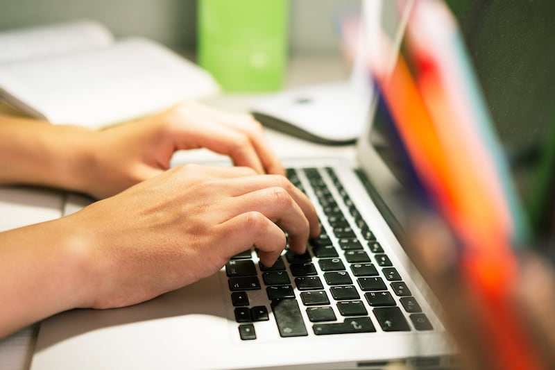 teen with laptop student