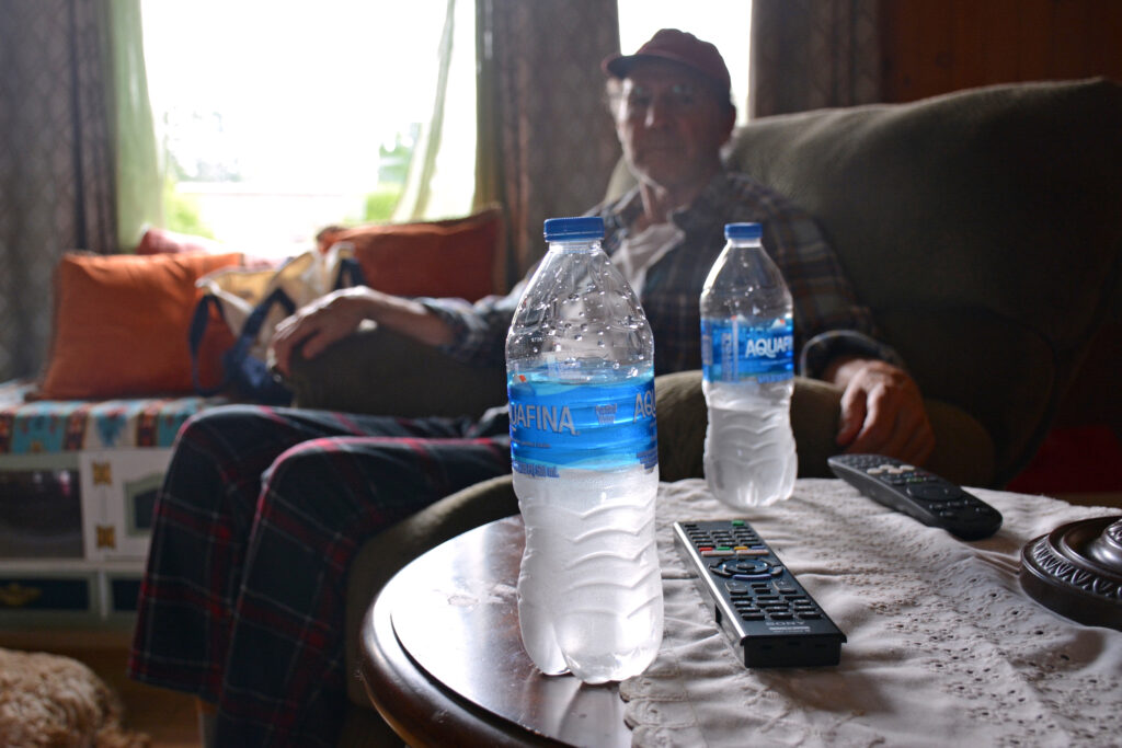 Brian Altvater’s household relies on bottled water because the tap water at Sipayik is frequently contaminated. Credit: Sydney Cromwell/Inside Climate News
