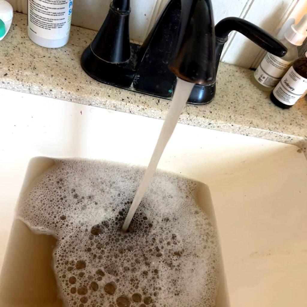 Brown water flows from a Sipayik resident’s faucet during a discoloration event in the reservation’s tap water supply. Credit: Courtesy of Billy Longfellow