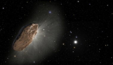 A large rocky comet floats in the darkness of space with some stars in the distance.