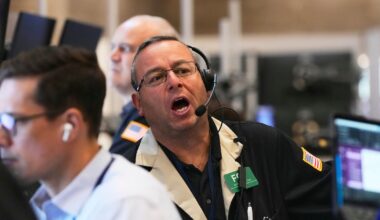 Wall Street ticks toward another record