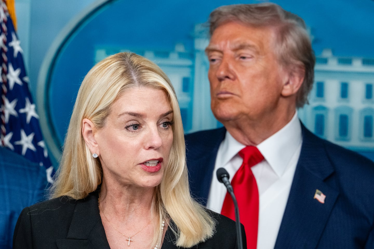 Attorney General Pam Bondi, center, speaks as President Trump listens during a White House news conference on crime in Washington.