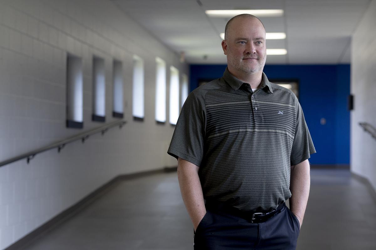 Cook County Public Schools Superintendent Chris Lindholm stands for a portrait in the school hallway