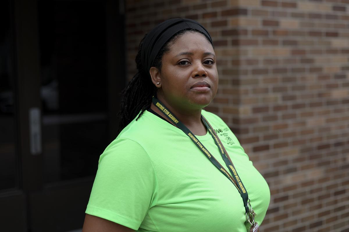 Yolonda Rogers, a mental health specialist, stands for a portrait outside Heritage Academy 