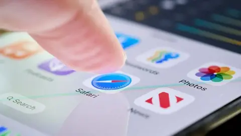 Getty Images A finger about to press the safari app on a smarthphone