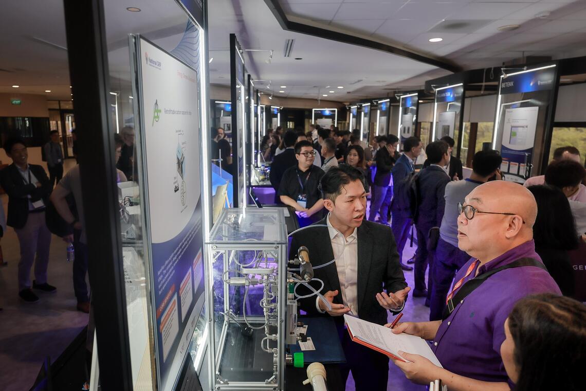 Exhibition booths at the official opening of the NUS i3 building at NUS on Sep 16, 2025.