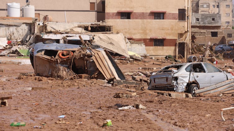 Abandoned cars and debris strewn across the flood-hit city of Derna.