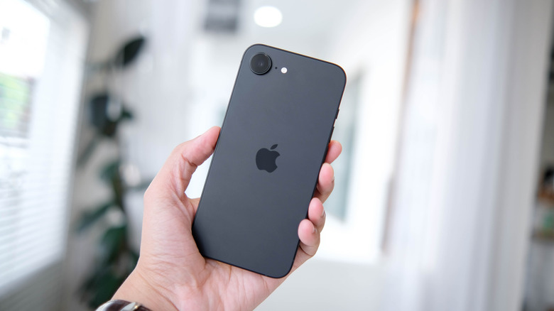 The iPhone 16e in hand.