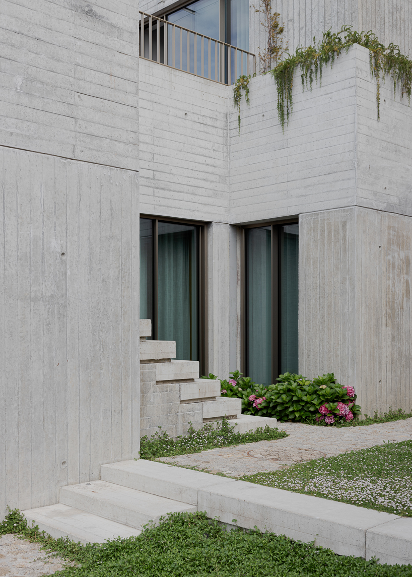renovated porto residence reimagines hillside terraces with stepped concrete layers