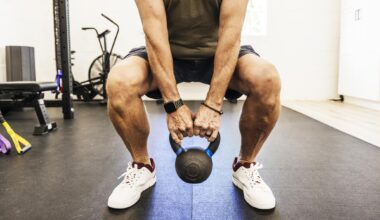 a man doing a kettlebell squat