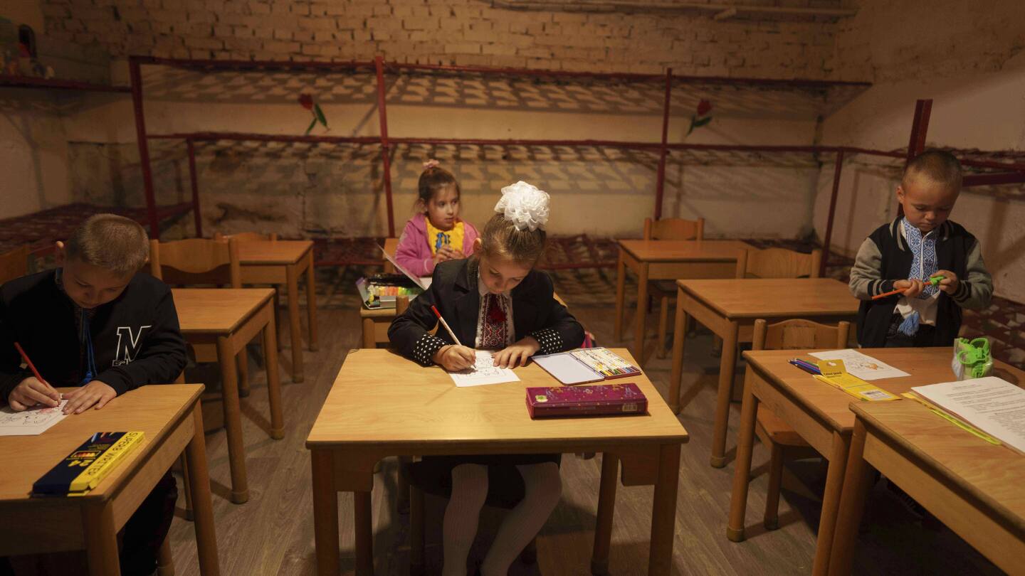 AP photographers capture Ukraine students' first day in underground school