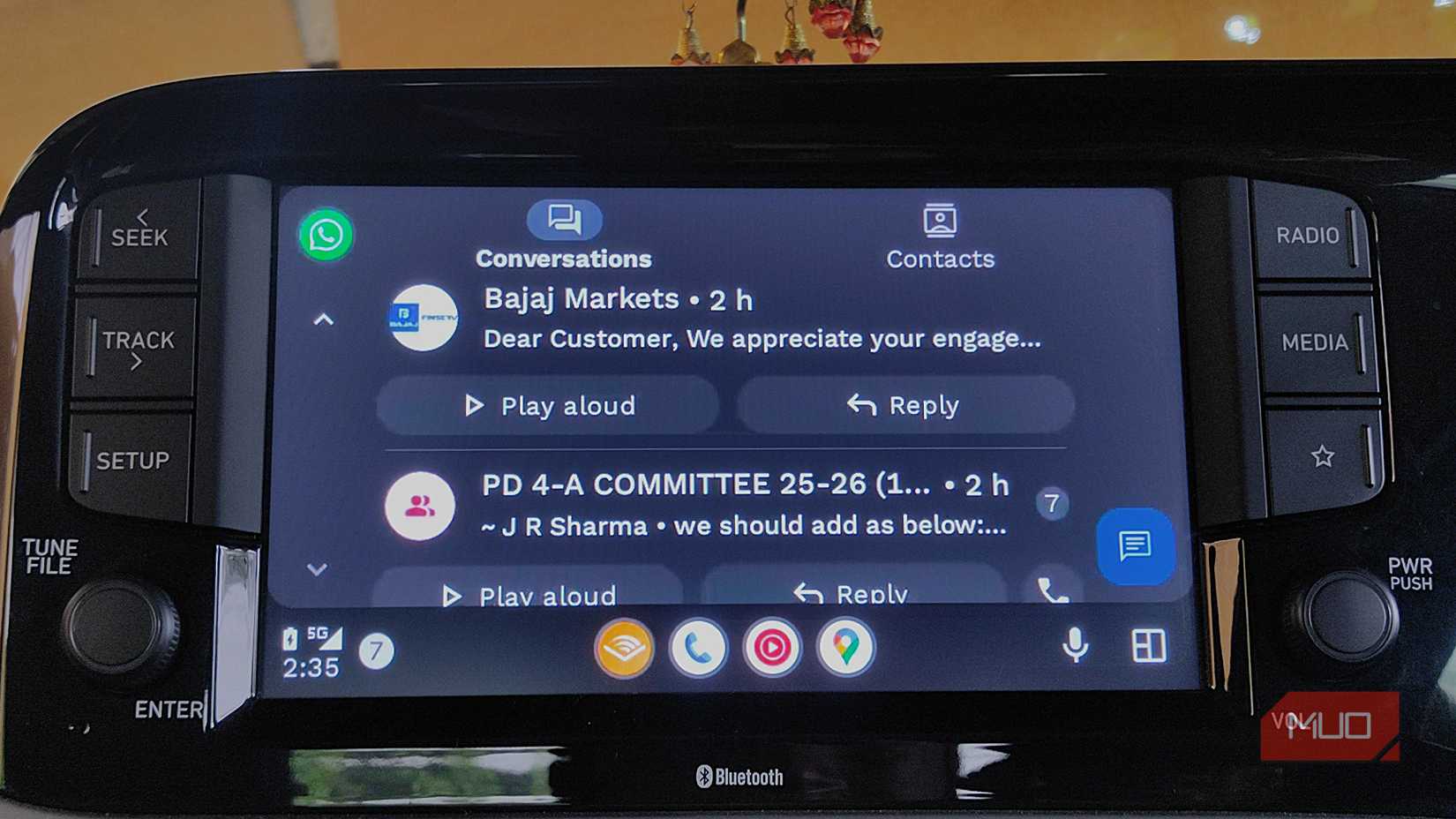 WhatsApp home screen with multiple messages visible with an option to real aloud on Android Auto.