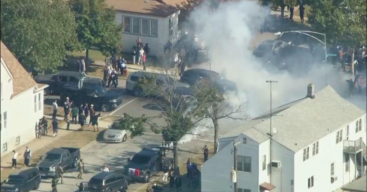 Federal agents fire tear gas during standoff with crowd in East Side, Chicago, after car crash