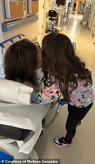 Gonzalez is pictured in the hospital with her daughter