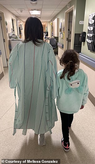 Gonzalez is pictured in the hospital with her daughter