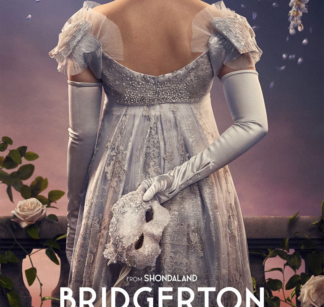 person in a white dress holding a mask