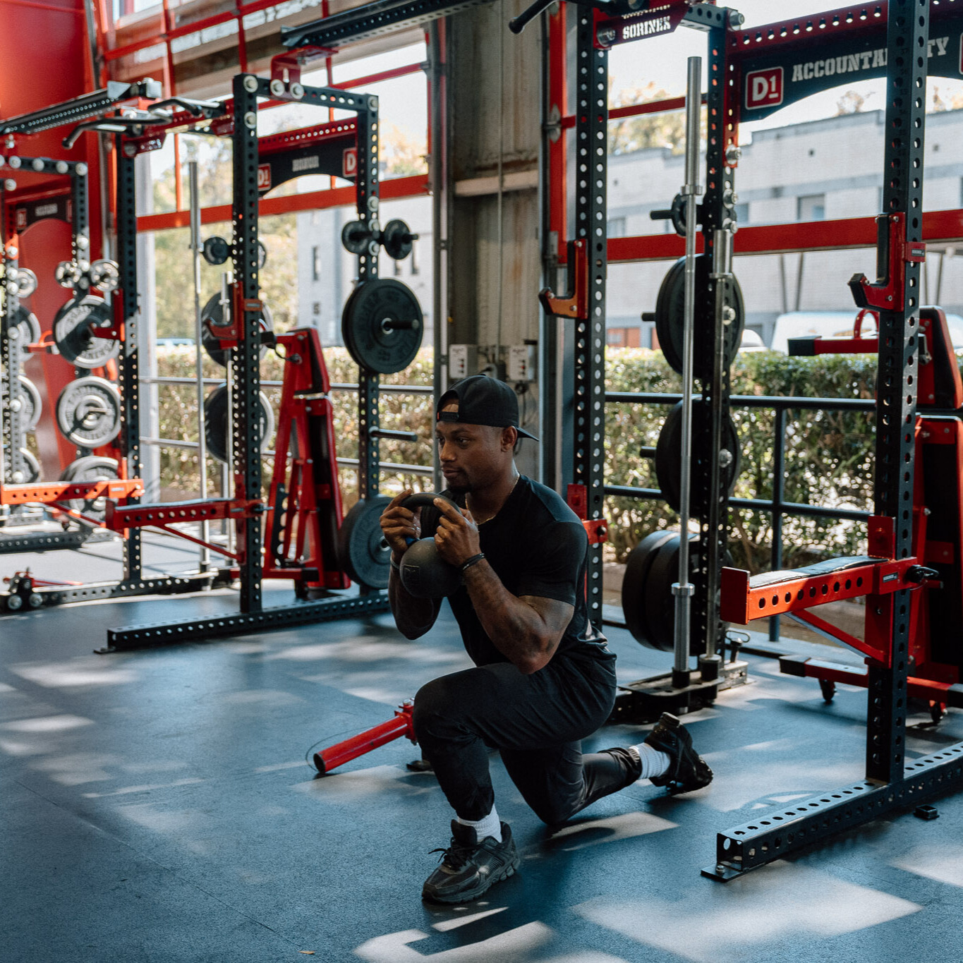 Man demonstrates kettlebell exercise in gym