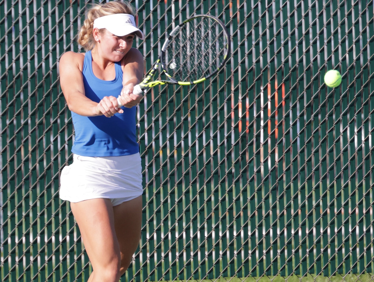 girls high school tennis action