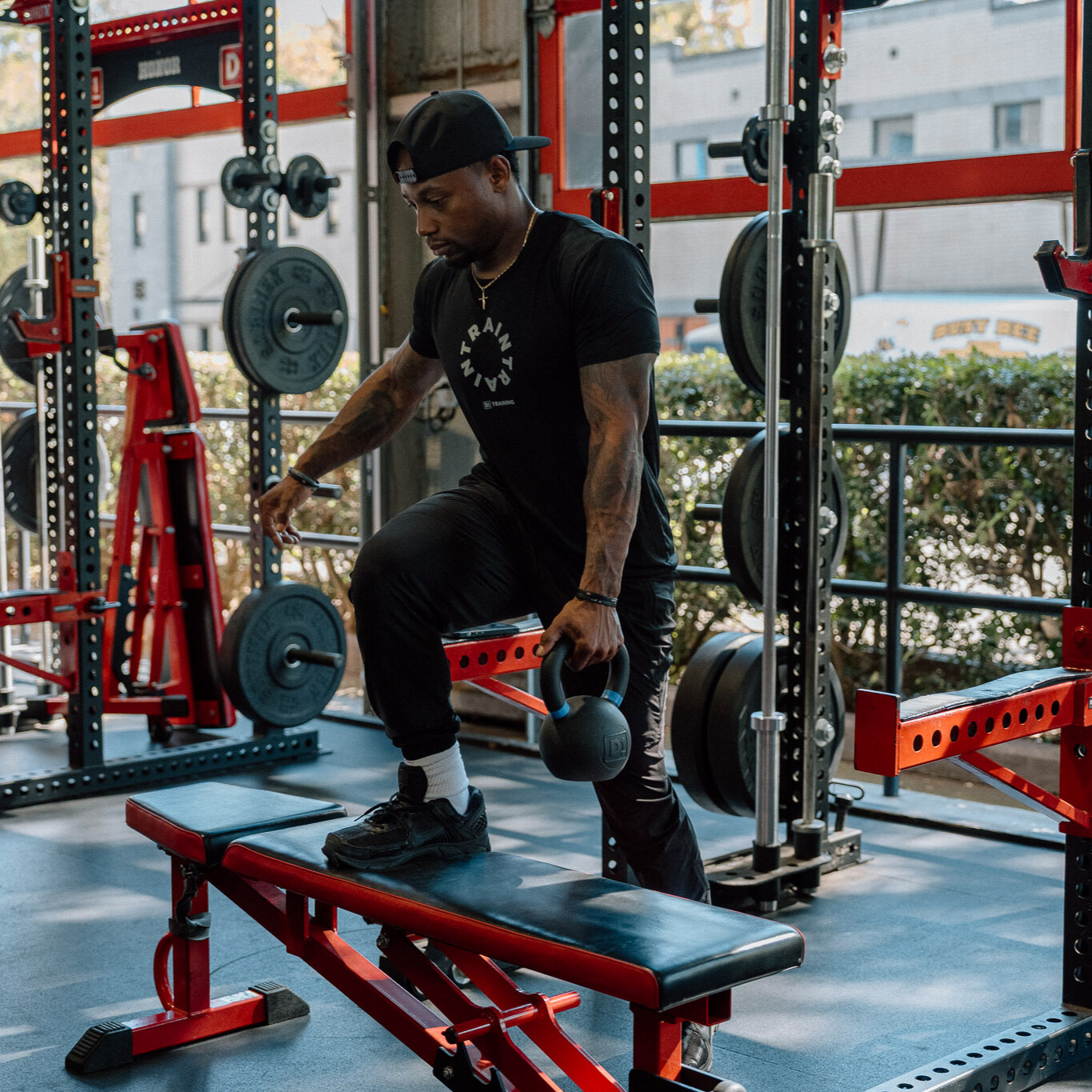 Man demonstrates kettlebell exercise in gym