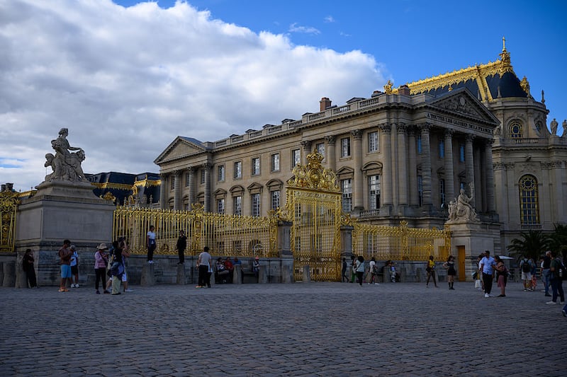 A view of the gates at Château de Versailles on August 28, 2025 in Versailles, France. The Palace was originally built as a hunting lodge in 1623 by King Louis XIII. His successor Louis XIV expanded the chateau into a palace in several phases from 1661 to 1715.