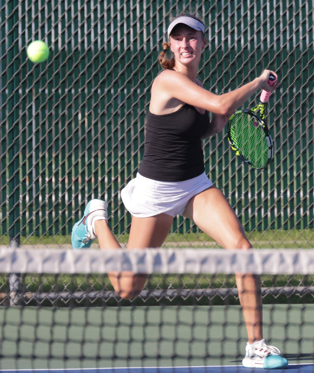 girls high school tennis action
