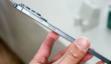 Unbranded smartphone held in hand showing volume buttons.