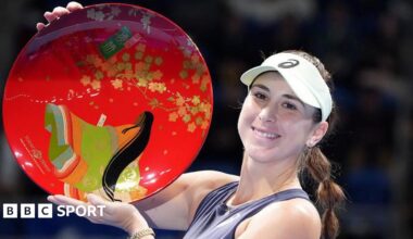 Belinda Bencic of Switzerland poses with the trophy
