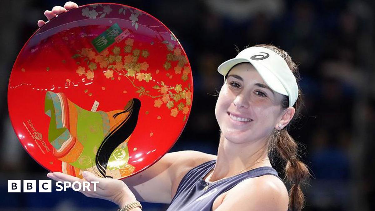 Belinda Bencic of Switzerland poses with the trophy